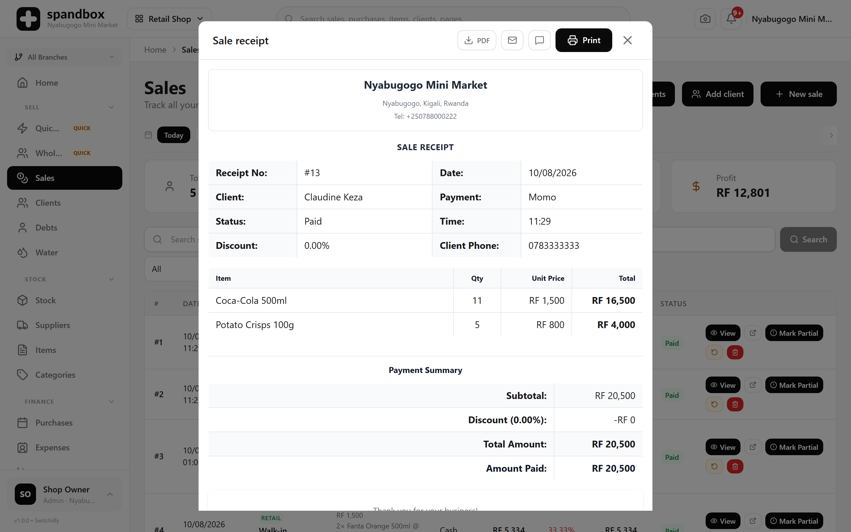A Spandbox sale receipt: shop header, receipt number, client, payment method, itemised lines and payment summary.